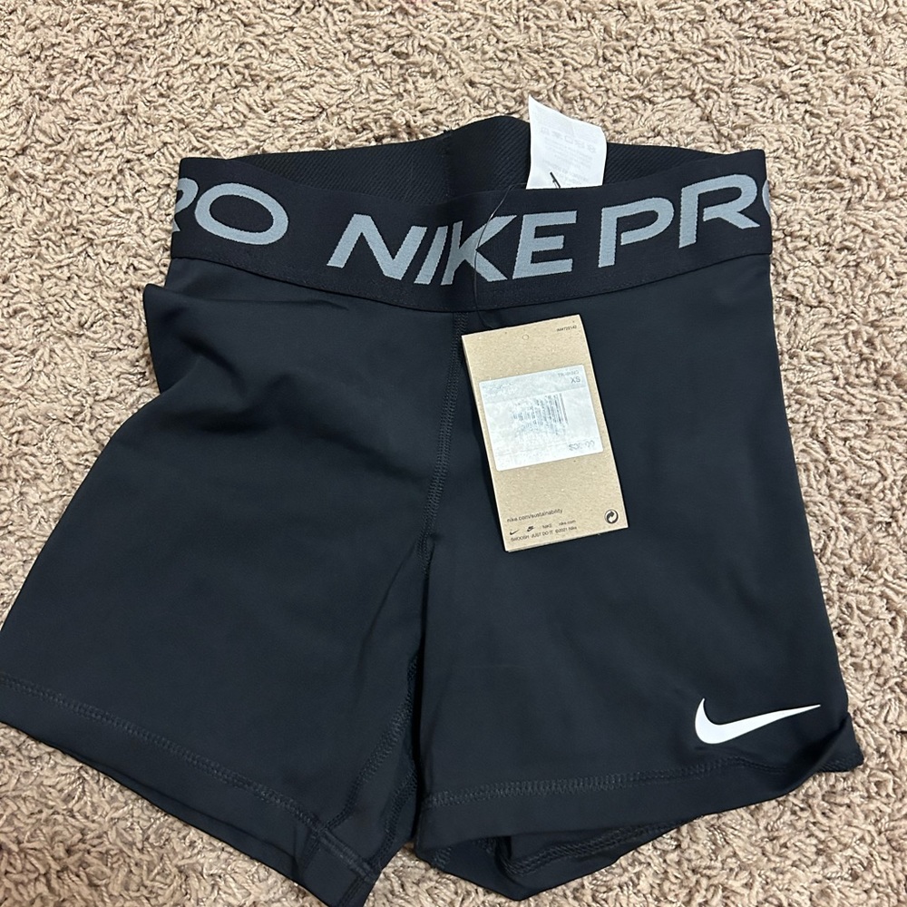 Black Nike Pros, New with tag, Never worn and perfect condition, Size AXS